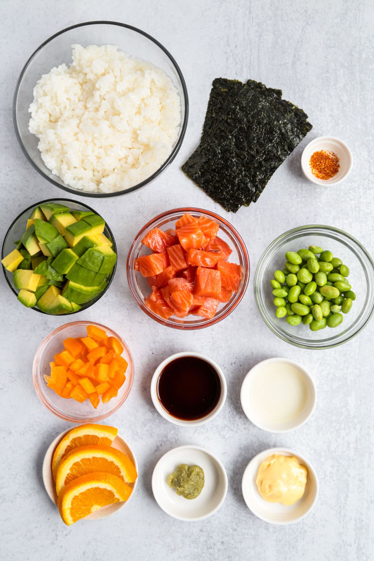 salmon, rice, avocado, edamame, nori, and other ingredients for chirashi bowl